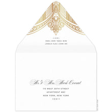 Load image into Gallery viewer, White envelope, gold deco pattern on the tip of the envelope flap. Black san serif return address. Black block and script mailing address on the front of the envelope.