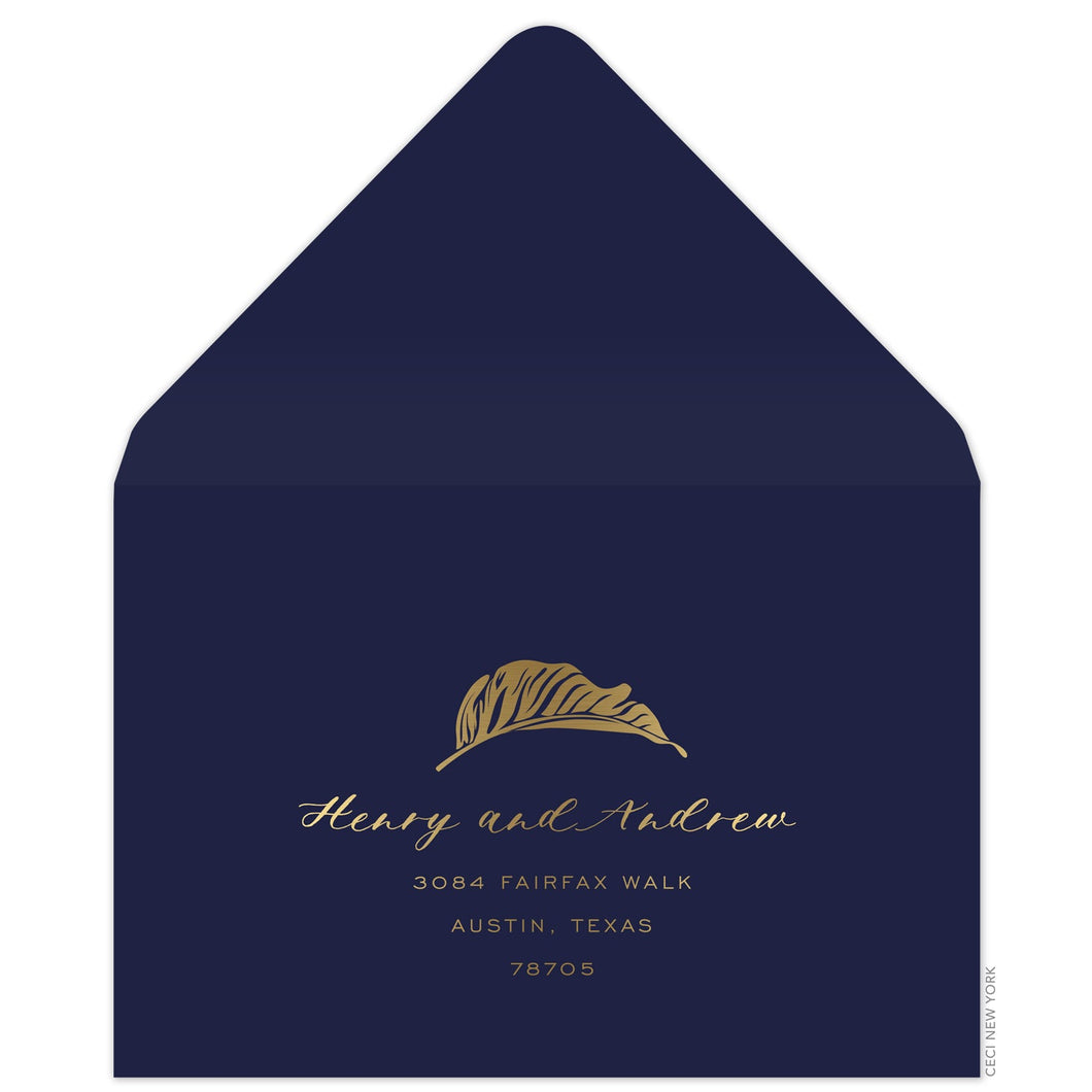 Navy reply envelope, gold modern palm leaf and script and san serif font centered on the front.