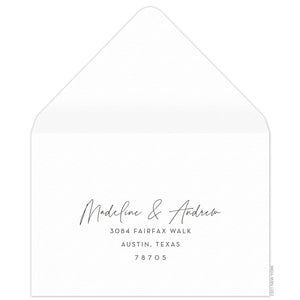 White reply envelope with script and block return address centered on the front of the envelope.