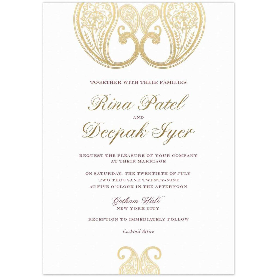 a white paper invitation with south asian gold designs at the top and bottom and dark gold script names and maroon block font