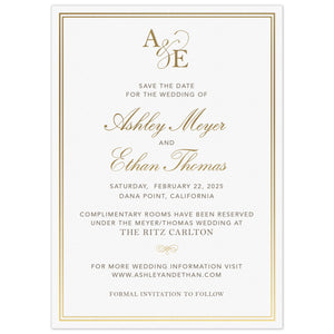 Simple save the date with a double line border. Block pewter and gold script font centered on the page. Block initials and script ampersand monogram at the top of the card.