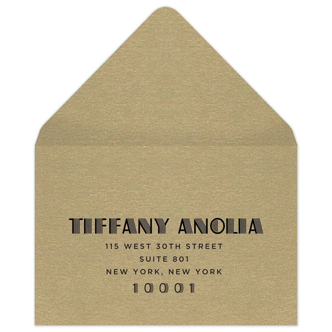 Gold reply envelope with black deco font centered on the front of the envelope.