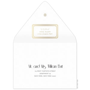 Gold decorative box holding the return address on the back of the envelope flap. Small circle logo on the tip of the flap. Black deco and block copy centered on the front of the envelope.