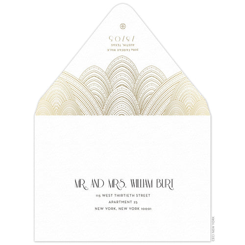 White envelope with sweeping gold line design, gold deco font underneath the design, small Ceci logo on the tip of the flap. Black deco font centered on the font of the envelope.