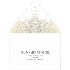 White envelope with sweeping gold line design, gold deco font underneath the design, small Ceci logo on the tip of the flap. Black deco font centered on the font of the envelope.