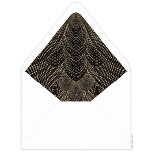 Gold line and dot in sweeping scallop pattern on an envelope liner with black background and white envelope.