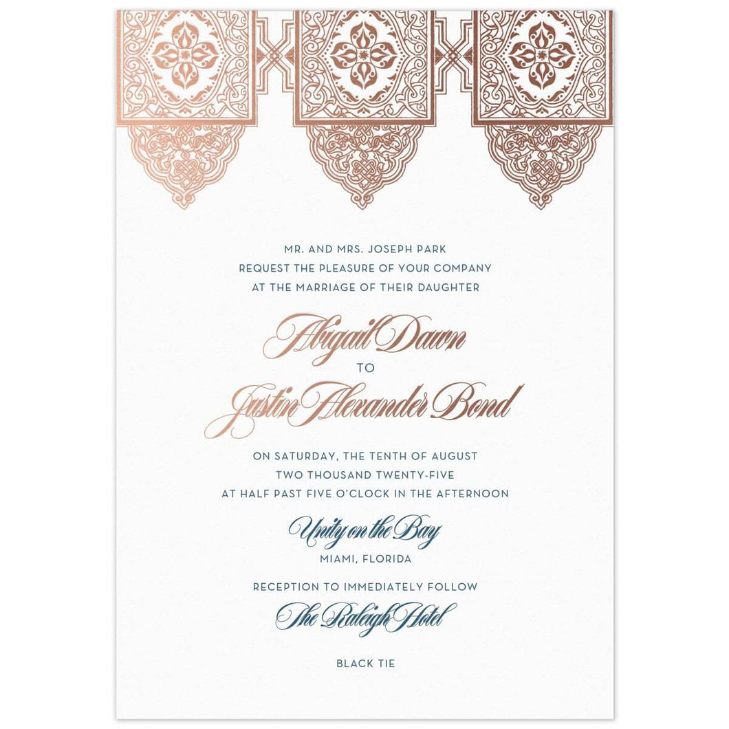 Middle Eastern design at the top of the card in rose gold foil. Teal block font and rose gold script font centered on the page under the design.