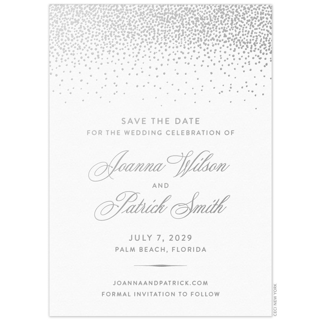 Silver small dots falling from the top of a white invitation. Block and script font centered underneath the dots on the middle of the card.