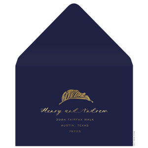Navy reply envelope, gold modern palm leaf and script and san serif font centered on the front.
