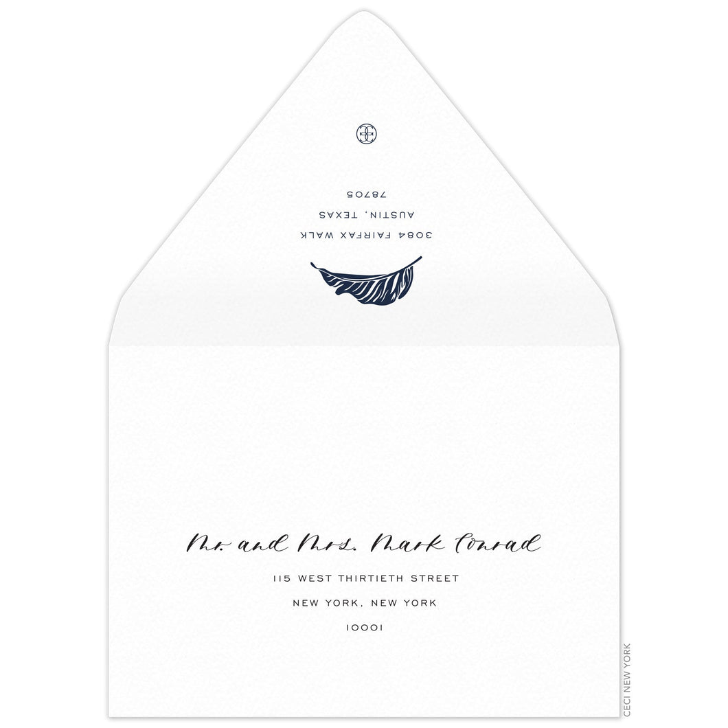 White envelope, san serif return address and modern palm leaf in navy on the back flap. Mailing address on the front of the envelope.