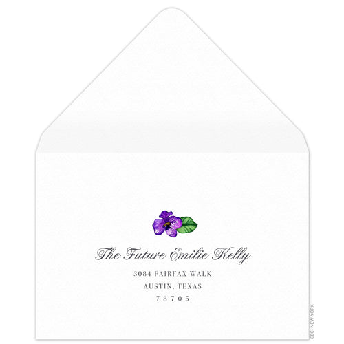 White reply envelope, script and block return address centered on the page, small watercolor orchid flourish