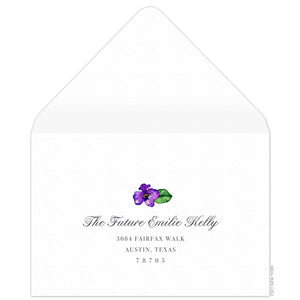 White reply envelope, script and block return address centered on the page, small watercolor orchid flourish