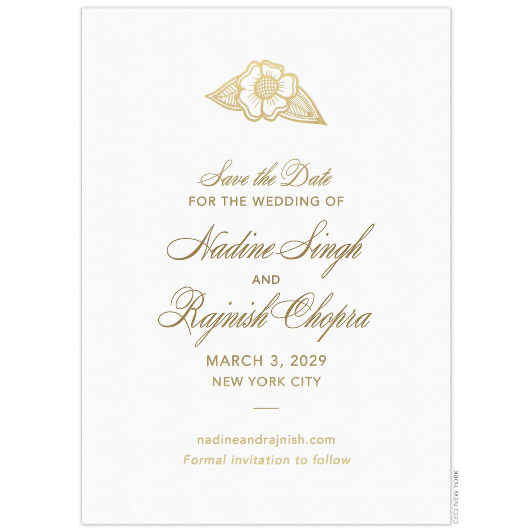 Gold flower motif at the top of a white card. Gold script and block copy centered on the card under the flower.
