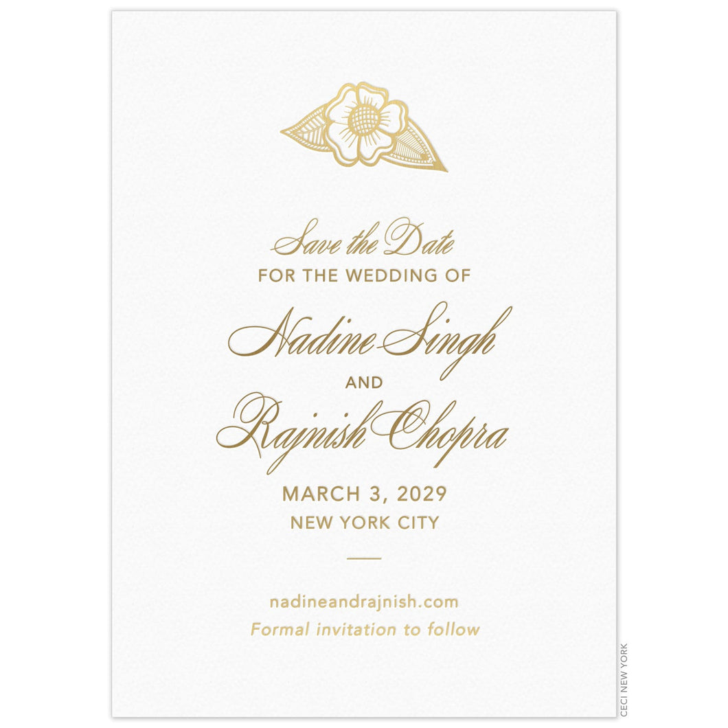 Gold flower motif at the top of a white card. Gold script and block copy centered on the card under the flower.
