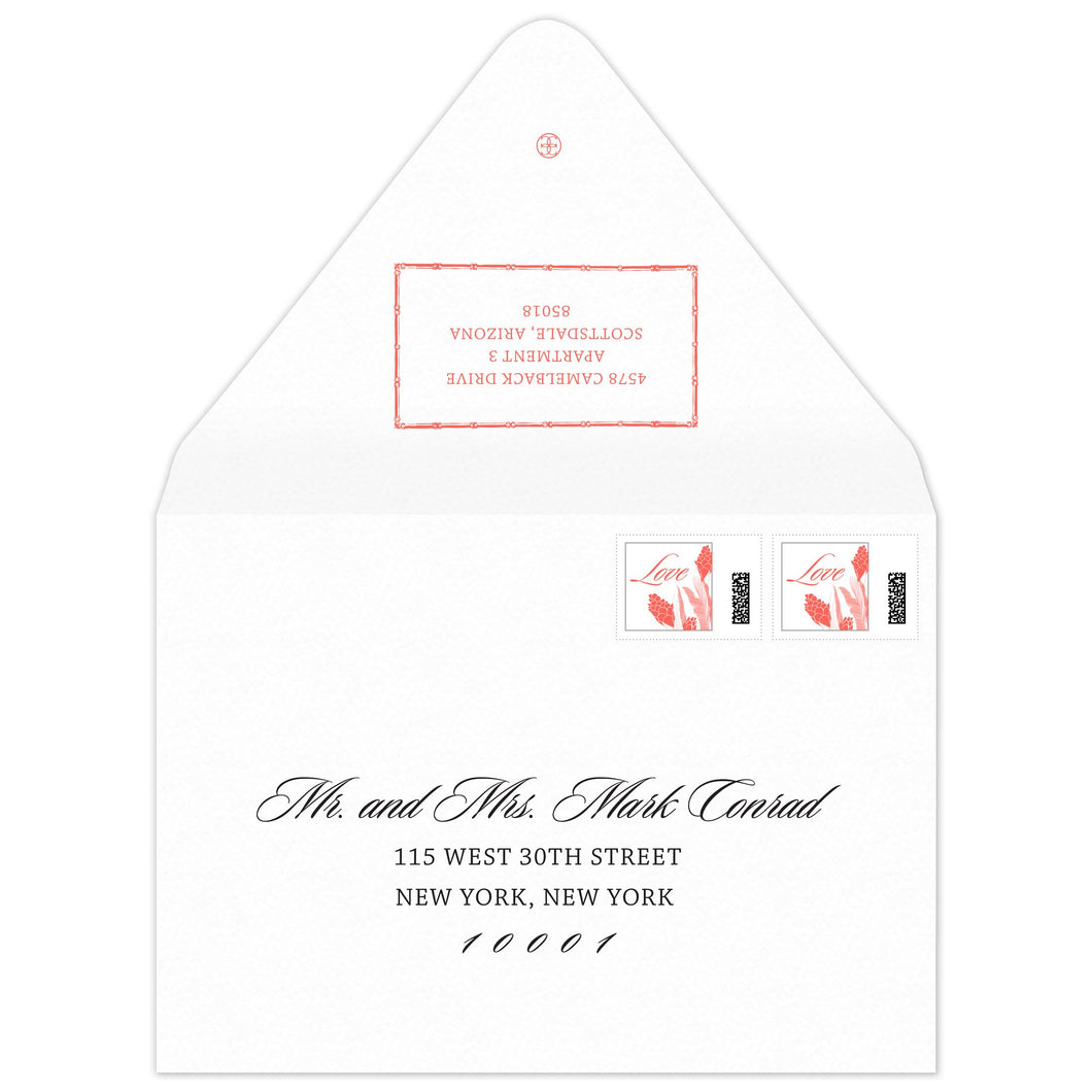 White envelope with coral bamboo rectangle holding return address. Script and block font on the front of the envelope.