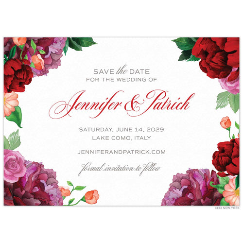 A white save the date with watercolor pink and red colored flowers on the corners and right and left sides. Red script with grey block font centered on the card.