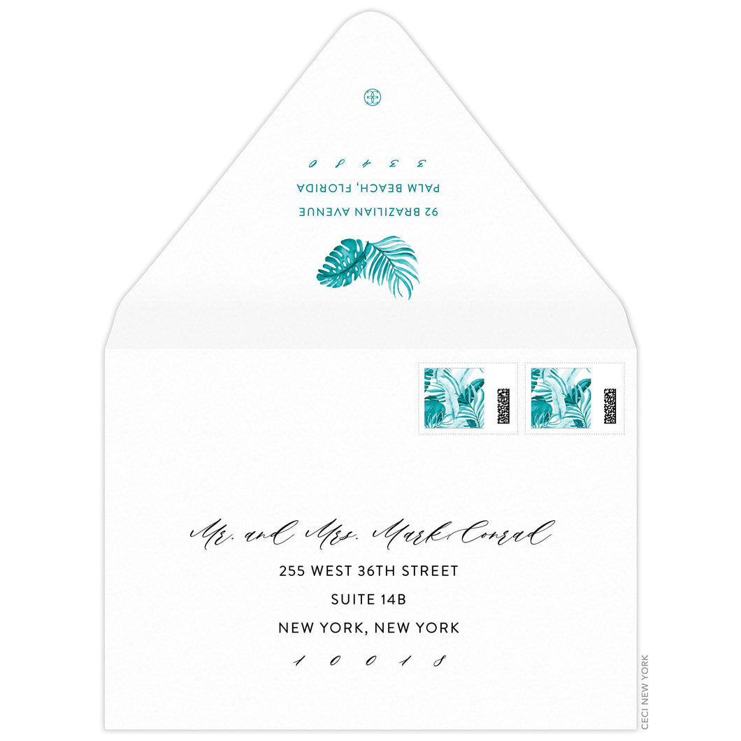 Turquoise watercolor palm leaves on top of return address on back flap of a white envelope. Script and block address on the front of the envelope.