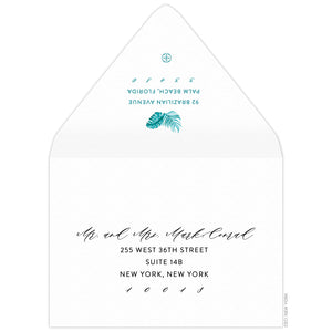 Turquoise watercolor palm leaves with return address centered underneath on the back flap. Black script and san serif address on the font.