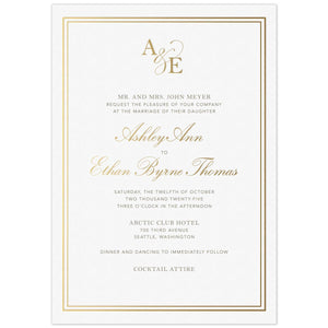 a white paper invitation with gold borders and gold initials at the top and gold script and black block fonts