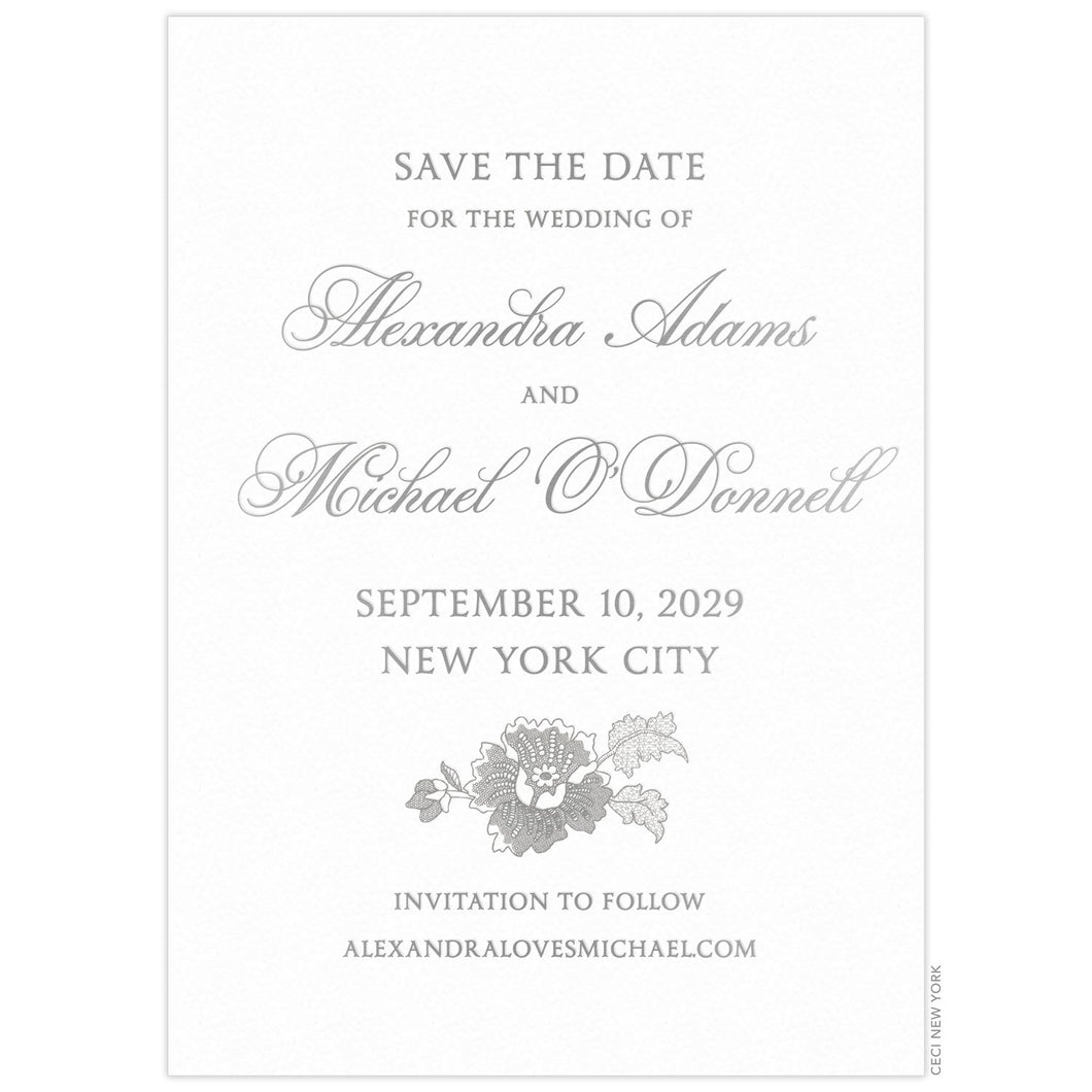 a white paper save the date with gray script and block font and floral design