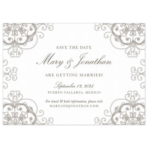 White horizontal save the date with circle and scroll pattern in pewter in all the corners of the card. Block and script font in pewter centered on the page.