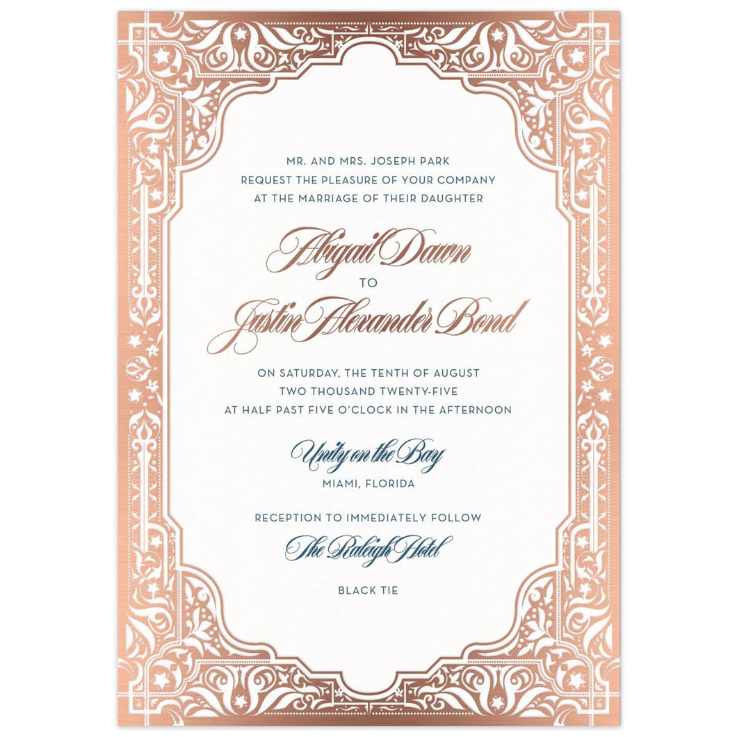 Middle Eastern border in rose gold on all edges of the invitation card. Navy and Rose gold block and script font centered in the frame.l