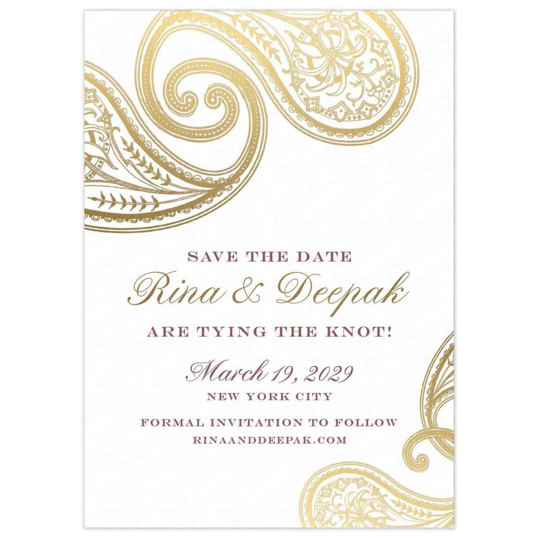 Two large intricate paisleys on the top left corner of the card in gold foil. Smaller paisleys in the bottom right corner in gold foil. Block and script font in maroon and gold centered on the page.