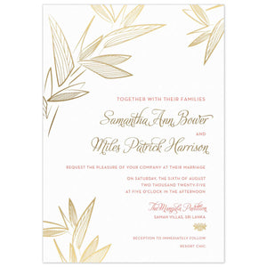 White invitation with modern leaves on the top corners and bottom left corner. Pink block font and gold script font right aligned with a gold Thai flourish. 