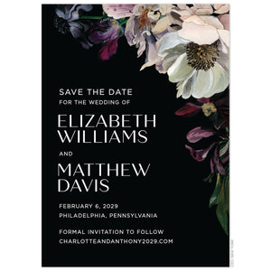 Moody, watercolor flowers on the top right corner in maroon, grey, green, deep purple and dusty blush on a black border. White block font and handwritten script font left aligned on the save the date.